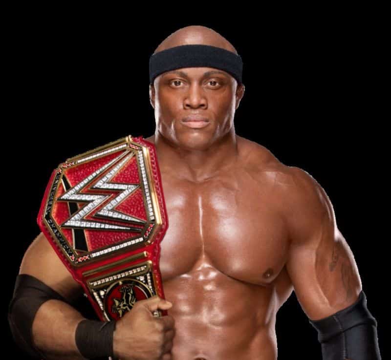 Bobby Lashley in a black head band holding his WWE universal championship belt.
